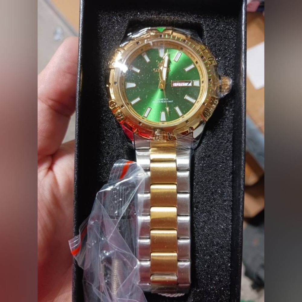 Gold and Silver Watch with Green Dial
